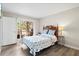 Cozy bedroom with a private outdoor patio, wooden furniture and warm interior at 1051 Forrest Nelson Blvd # A-103, Port Charlotte, FL 33952