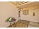Inviting entryway with decorative plants, neutral paint, and a secure front door at 1051 Forrest Nelson Blvd # A-103, Port Charlotte, FL 33952