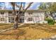 Townhouse featuring mature trees and accessible parking at 1051 Forrest Nelson Blvd # A-103, Port Charlotte, FL 33952