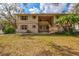 Charming two-story condo featuring neutral siding, shutters and a well-maintained lawn at 1051 Forrest Nelson Blvd # A-103, Port Charlotte, FL 33952