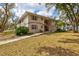 Charming two-story condo featuring neutral siding, shutters and a well-maintained lawn at 1051 Forrest Nelson Blvd # A-103, Port Charlotte, FL 33952