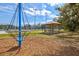 A picnic area featuring a gazebo and picnic tables, set beside playground equipment at 1051 Forrest Nelson Blvd # A-103, Port Charlotte, FL 33952