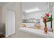 Bright kitchen featuring white cabinets, modern appliances, and an inviting eat-in area at 1051 Forrest Nelson Blvd # A-103, Port Charlotte, FL 33952