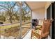 Screened-in porch showcasing two rocking chairs and a great view of the community at 1051 Forrest Nelson Blvd # A-103, Port Charlotte, FL 33952