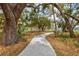 Meandering community walking path through shady trees. A great place to walk a dog or meet a neighbor at 1051 Forrest Nelson Blvd # A-103, Port Charlotte, FL 33952