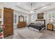 Bright bedroom with a decorative ceiling, hardwood floors, and a serene atmosphere at 1115 Gladstone Blvd, Englewood, FL 34223