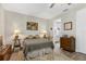 Cozy bedroom with warm lighting, ensuite bathroom, and wood flooring at 1115 Gladstone Blvd, Englewood, FL 34223