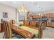 Open concept formal dining room that leads to the kitchen, and a view of the living room at 1115 Gladstone Blvd, Englewood, FL 34223
