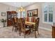 Formal dining room with a wooden table, decorated chairs, and decorative lighting at 1115 Gladstone Blvd, Englewood, FL 34223