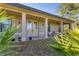 Inviting front porch with stylish columns and double doors welcomes you home at 1115 Gladstone Blvd, Englewood, FL 34223