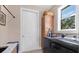 A bright laundry room with modern washer and dryer units and ample natural light at 1115 Gladstone Blvd, Englewood, FL 34223
