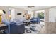 Spacious living room features stylish furniture and access to the outdoor pool area at 1115 Gladstone Blvd, Englewood, FL 34223