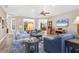 Bright and airy living room with vaulted ceilings and access to the outdoor pool area at 1115 Gladstone Blvd, Englewood, FL 34223
