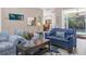 Comfortable living room with stylish furniture, open to the dining area and pool at 1115 Gladstone Blvd, Englewood, FL 34223
