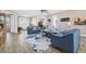 Open-concept living area with ample seating and views of the entrance and backyard at 1115 Gladstone Blvd, Englewood, FL 34223