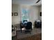 Home office with wood plank floors, window with wood shutters, and an office desk at 1115 Gladstone Blvd, Englewood, FL 34223