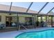 Enjoy a pool with screened-in enclosure and covered patio that are perfect for entertaining at 11208 Grafton Ave, Englewood, FL 34224