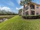 Exterior view of the house from the backyard showing a beautiful body of water at 142 Bella Vista Ter # A, North Venice, FL 34275