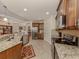 Spacious kitchen featuring stainless steel appliances and a large island with seating at 142 Bella Vista Ter # A, North Venice, FL 34275