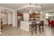 Modern kitchen features granite countertops, stainless steel appliances and a breakfast bar at 142 Bella Vista Ter # A, North Venice, FL 34275