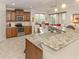 Kitchen showcasing granite countertops, stainless steel appliances, and a view into the breakfast nook at 142 Bella Vista Ter # A, North Venice, FL 34275