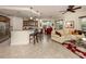 Open floor plan with a modern kitchen, dining area, and comfortable living room at 142 Bella Vista Ter # A, North Venice, FL 34275