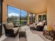 Relaxing screened lanai with comfortable seating overlooking the beautiful scenery at 142 Bella Vista Ter # A, North Venice, FL 34275
