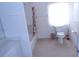 Well-lit bathroom features a shower-tub combo, toilet, vanity, and large window for natural light at 157 Algiers Dr, Venice, FL 34293