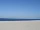 Beautiful beach with clear blue water and white sand under a sunny sky at 157 Algiers Dr, Venice, FL 34293