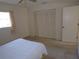 Bright bedroom with neutral walls, large closet, and window providing ample natural light at 157 Algiers Dr, Venice, FL 34293