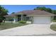 Charming single-story home with a two-car garage and well-maintained landscaping at 157 Algiers Dr, Venice, FL 34293