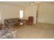 Cozy living area with carpeted floors, comfortable seating, and good natural light at 157 Algiers Dr, Venice, FL 34293