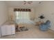 Bright living room featuring neutral carpet, comfortable seating, and sliding glass door to outside at 157 Algiers Dr, Venice, FL 34293