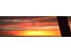 Dramatic sunset over the ocean with vibrant red, orange, and yellow hues at 157 Algiers Dr, Venice, FL 34293