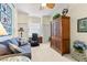 Bedroom with a desk, computer, couch, armoire, and a ceiling fan at 1610 Monarch Dr # 1610, Venice, FL 34293