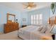 Bedroom with bright natural light, a ceiling fan, and a view of the window at 1610 Monarch Dr # 1610, Venice, FL 34293