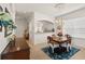 Elegant dining area with a traditional table and chairs, complemented by a decorative chandelier and natural light at 1610 Monarch Dr # 1610, Venice, FL 34293