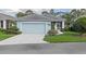 Charming single-story home featuring a two-car garage, screened porch, and well-maintained landscaping at 1610 Monarch Dr # 1610, Venice, FL 34293