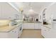 Spacious kitchen featuring granite countertops, ample white cabinetry, and modern appliances with an open layout at 1610 Monarch Dr # 1610, Venice, FL 34293