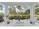 Lanai showcasing peaceful view of manicured backyard and neighborhood at 1610 Monarch Dr # 1610, Venice, FL 34293