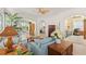 Open living room featuring tile flooring, ceiling fan, archway, and view to lanai at 1610 Monarch Dr # 1610, Venice, FL 34293
