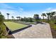 Community bocce ball courts with a paver path and lush landscaping at 16131 Poplar Hill Ln, Port Charlotte, FL 33953