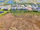 An aerial view of a home surrounded by community amenities and natural Florida landscape at 18135 Home Run Dr, Venice, FL 34293