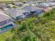 An aerial view showcasing multiple screened-in pools in a Florida community at 18135 Home Run Dr, Venice, FL 34293