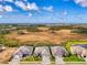 Expansive aerial view showcasing the home's location within the neighborhood and surrounding landscape at 18135 Home Run Dr, Venice, FL 34293