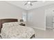 Bedroom features a decorative ceiling fan and neutral paint at 18135 Home Run Dr, Venice, FL 34293