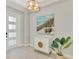 Inviting foyer featuring tile floors, decorative lighting, and stylish furnishings at 18135 Home Run Dr, Venice, FL 34293