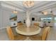 Spacious open-concept living space with large windows, stylish furniture, and natural light at 18135 Home Run Dr, Venice, FL 34293