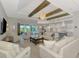 Open concept living room with a large sliding glass door and a view of the outdoor area at 18135 Home Run Dr, Venice, FL 34293