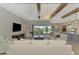 Spacious living room with a large sliding glass door and an open floor plan at 18135 Home Run Dr, Venice, FL 34293